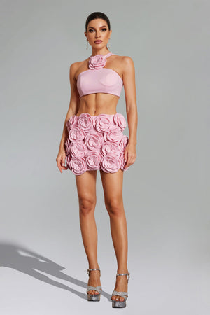 Ezgi çiçek desenli halter yaka mini etek seti, pembe renkli.