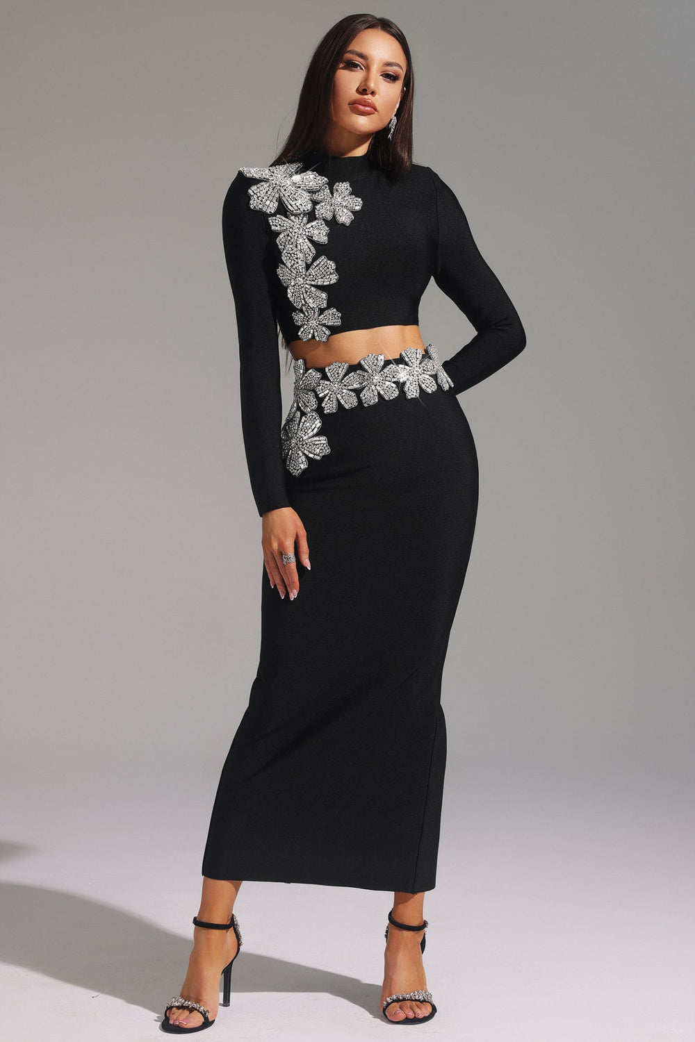 Stretch fabric dress fitting snug at bust, waist, and hips in a solid color.