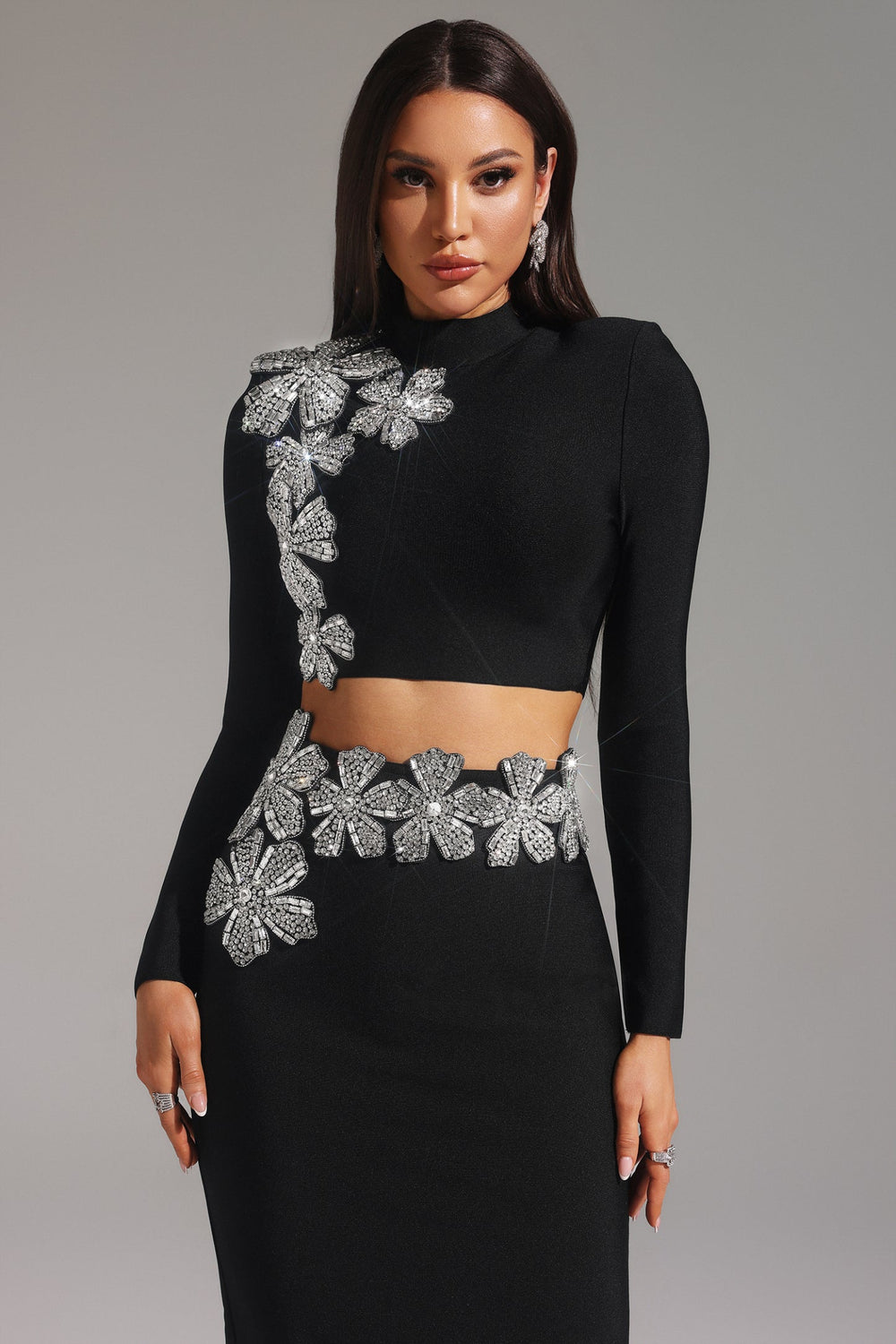 Stretch fabric dress fitting snug at bust, waist, and hips in a solid color.