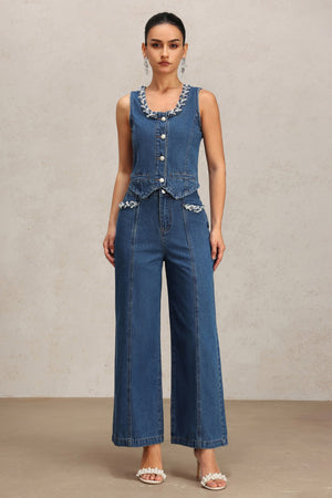 Denim kolsuz yelek ve pantolon ikili takım, mavi renkli.