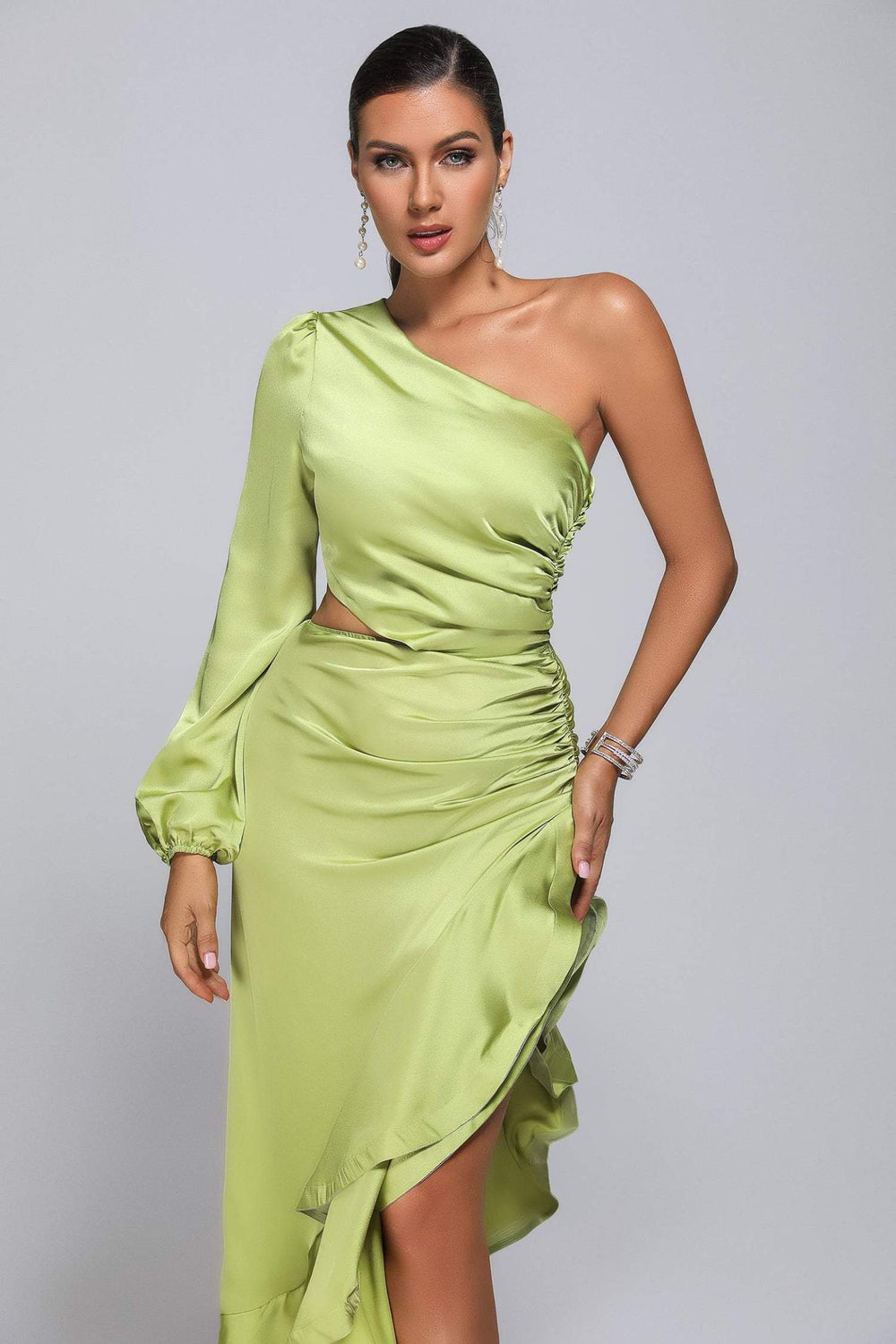 Peppermint green satin one-shoulder maxi dress with lacy hem.